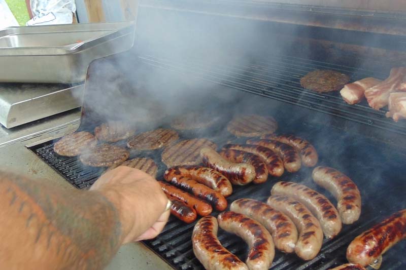 Meat smoking on a grill