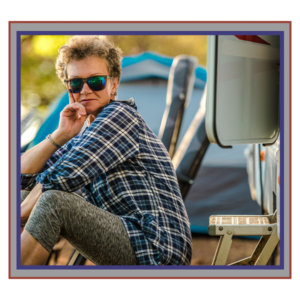 young man sitting outside of at an rv camp