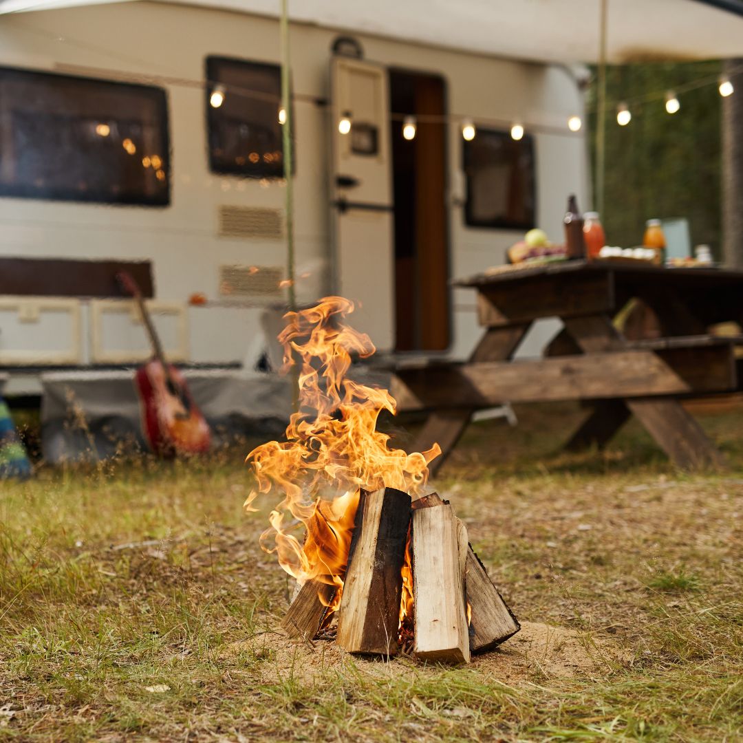 campfire outside an RV