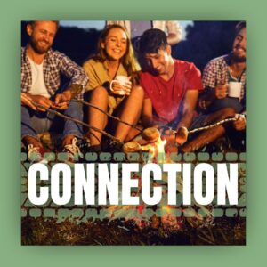 Connection title - people smile and laugh around a campfire