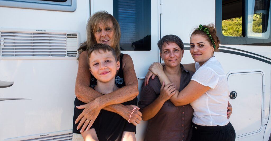 Family picture outside of an RV